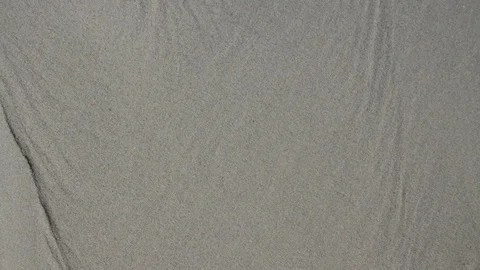 The word "idea" slowly appears on sand Video stock 80051999