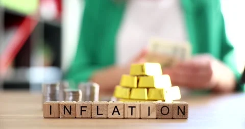 Word inflation on background of gold bars and coins 4k movie slow motion Vídeos de archivo 247045035