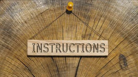 The word instructions. Background log written on wooden board Foto stock