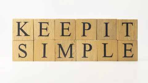 The word keep it simple was created from wooden cubes. education concept. Stock Photos