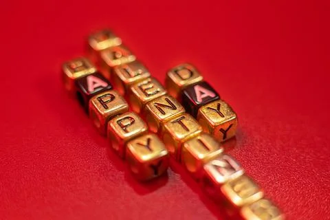 The word from the letter cubes put on the table a happy Stock Photos