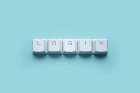 Word LOGIN written on computer keyboard keys isolated on a turquoise Stock Photos