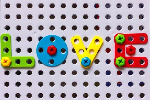 The word love made from multicolored constructor blocks Foto stock