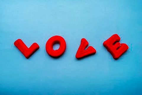 The word Love is made up of red letters on a blue background. Stock Photos