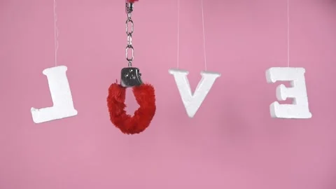Word "LOVE" on pink background. Stock Footage 147946410