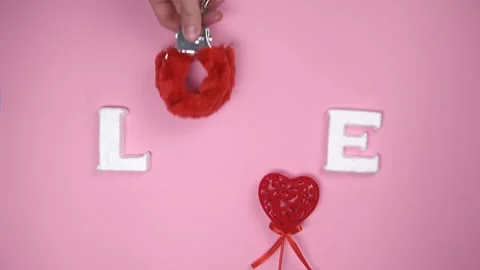 Word "LOVE" on pink background. Stock Footage 147946490