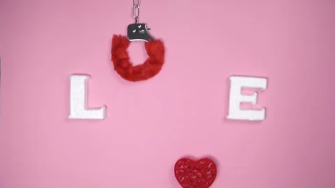 Word "LOVE" on pink background. Stock Footage 147946492