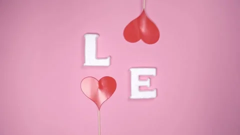 Word "LOVE" on pink background. Stock Footage 147947170