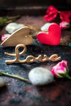 Word LOVE on rustic surface Stock Photos