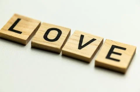 Word Love on a white surface. Stock Photos