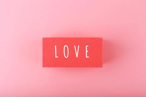 Word love written on red rectangle against pink background with copy space Stock Photos