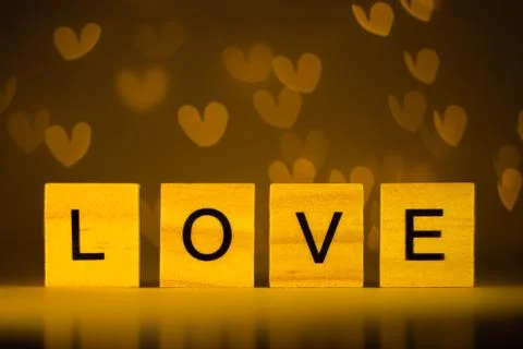Word love on a yellow background Foto stock