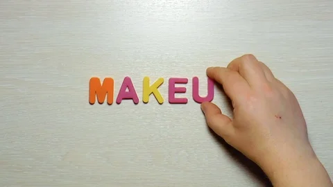 Word makeup is made up of plastic colored letters Stock Footage 79848685