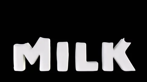 Word milk that falls from the top Stock Footage 143865664