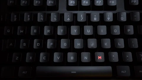 The word mistake is typed on a luminous computer keyboard. Black backlit Stock Footage 118277037