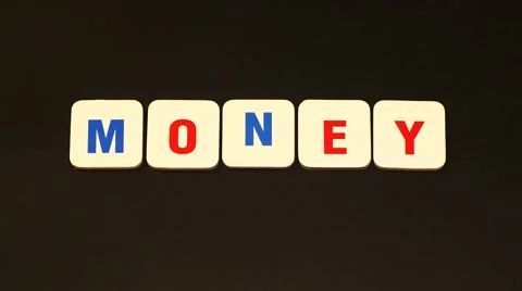 Word MONEY on black background. Stop motion Stock Footage