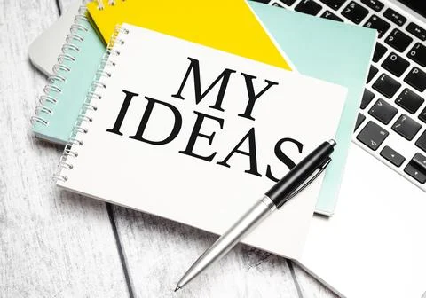 Word my ideas on notepad with pen and laptop Stock Photos