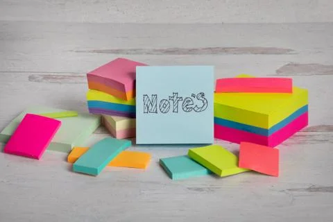 The word notes hand-drawn on a blue sticky posted note Stock Photos