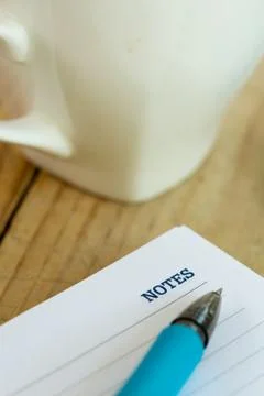 Word notes on the memos with pen and coffee on wooden background Stock Photos
