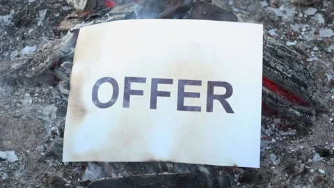 Word Offer on a white sheet of paper burns into a fire against. Slow motion Vídeo Stock 138691925