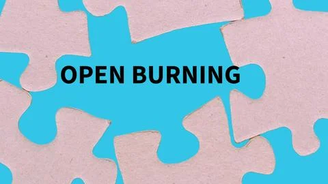 The word open burning in the gap of the puzzle Stock Photos