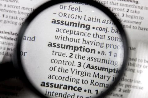 The word or phrase assumption in a dictionary. Stock Photos