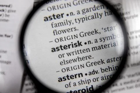 The word or phrase asterisk in a dictionary. Stock Photos