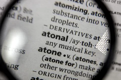The word or phrase atonal in a dictionary. Stock Photos