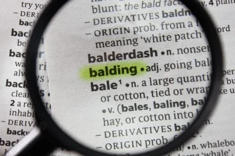 The word or phrase balding in a dictionary. Stock Photos