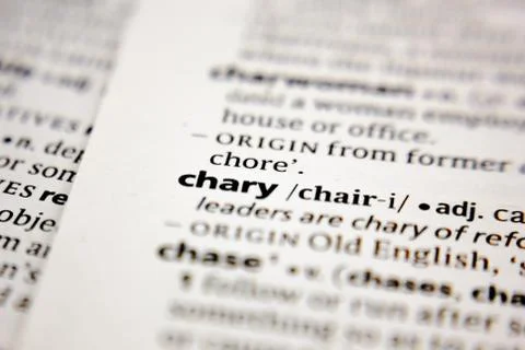 Word or phrase chary in a dictionary. Stock Photos