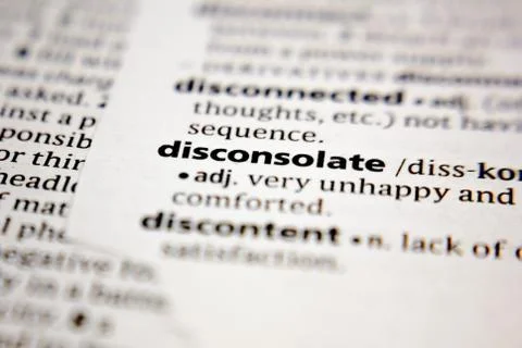 Word or phrase disconsolate in a dictionary. Stock Photos