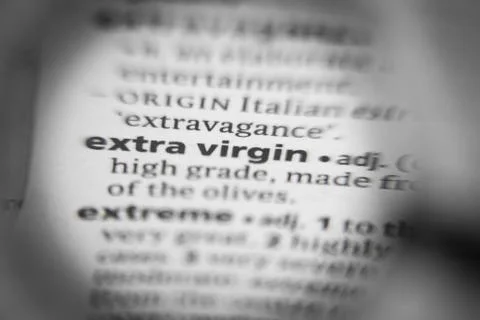 Word or phrase extra virgin in a dictionary. Stock Photos