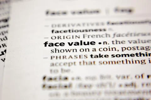 Word or phrase face value in a dictionary. Stock Photos