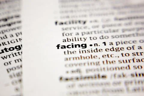 Word or phrase facing in a dictionary. Stock Photos