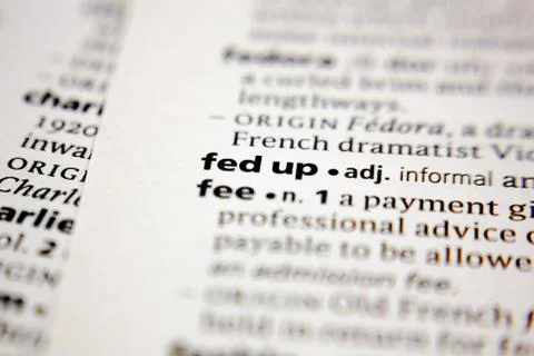 Word or phrase fed up in a dictionary. Stock Photos