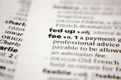 Word or phrase fee in a dictionary. Stock Photos