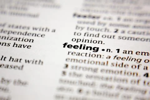 Word or phrase feeling in a dictionary. Stock Photos