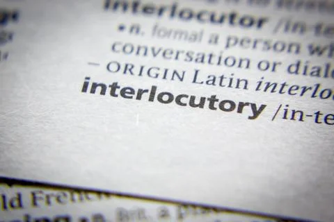 Word or phrase Interlocutory in a dictionary. Stock Photos