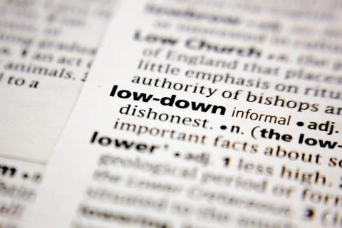 Word or phrase low-down in a dictionary. Stock Photos