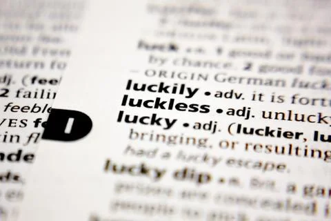 Word or phrase luckless in a dictionary. Stock Photos