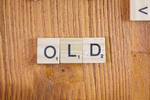 Word or phrase Old made with scrabble letters. Stock Photos