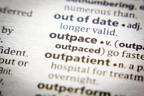 Word or phrase Outpace in a dictionary. Stock Photos