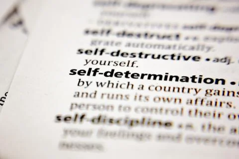 Word or phrase self-determination in a dictionary. Stock Photos