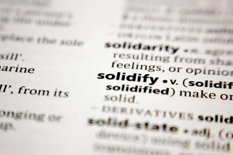 Word or phrase solidify in a dictionary. Stock Photos