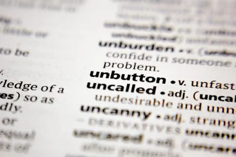 Word or phrase unbutton in a dictionary. Stock Photos
