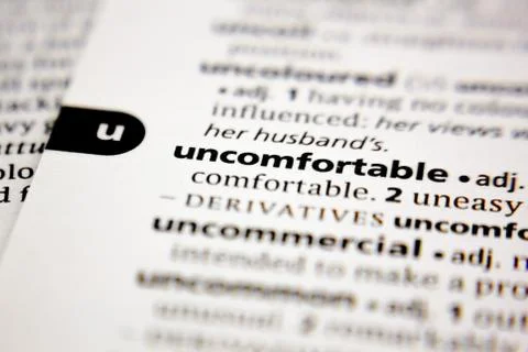 Word or phrase uncomfortable in a dictionary. Stock Photos