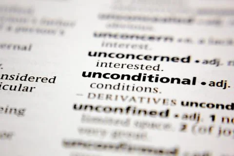 Word or phrase unconditional in a dictionary. Stock Photos