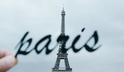 Word Paris at the Eiffel Tower, web banner Stock Photos