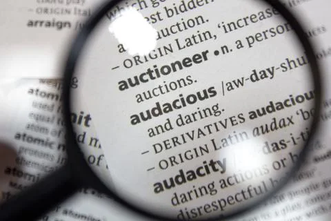 The word of phrase - audacious - in a dictionary. Stock Photos