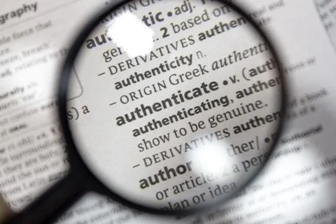 The word of phrase - authenticate - in a dictionary. Stock Photos